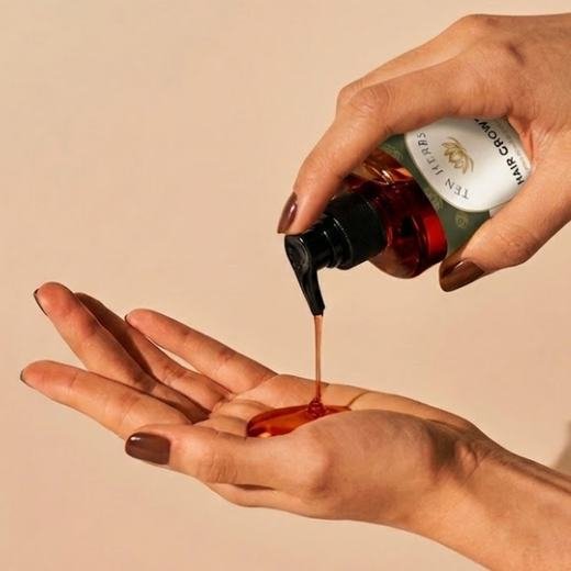 Pouring Ten Herbs oil into the palm