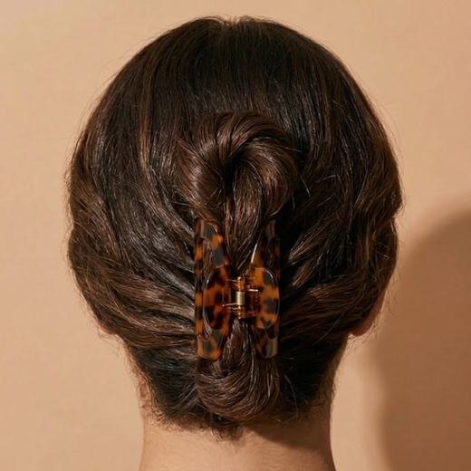Hair tied up while the oil stays on